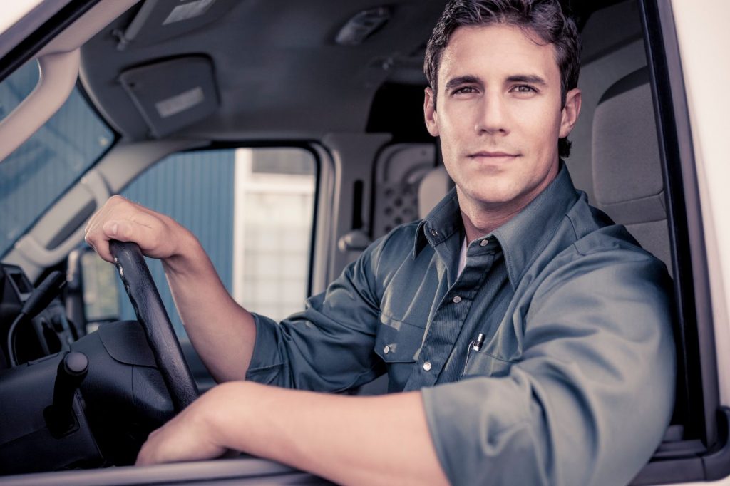 A gig worker checking their earnings on a mobile app with a concerned expression, highlighting potential wage theft and misclassification in the gig economy.